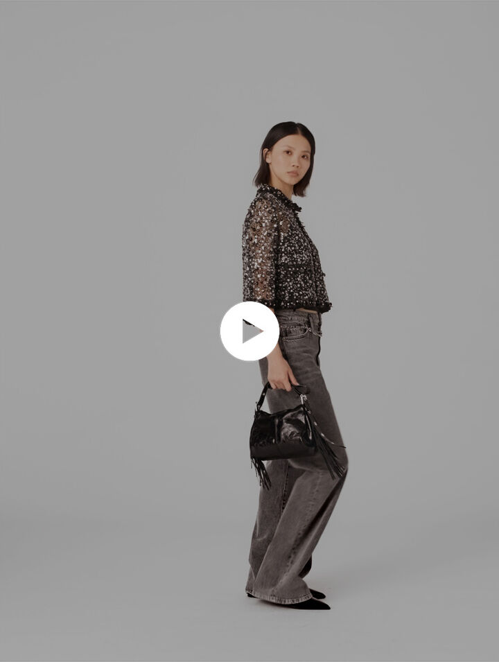 Polo con strass a motivo floreale
