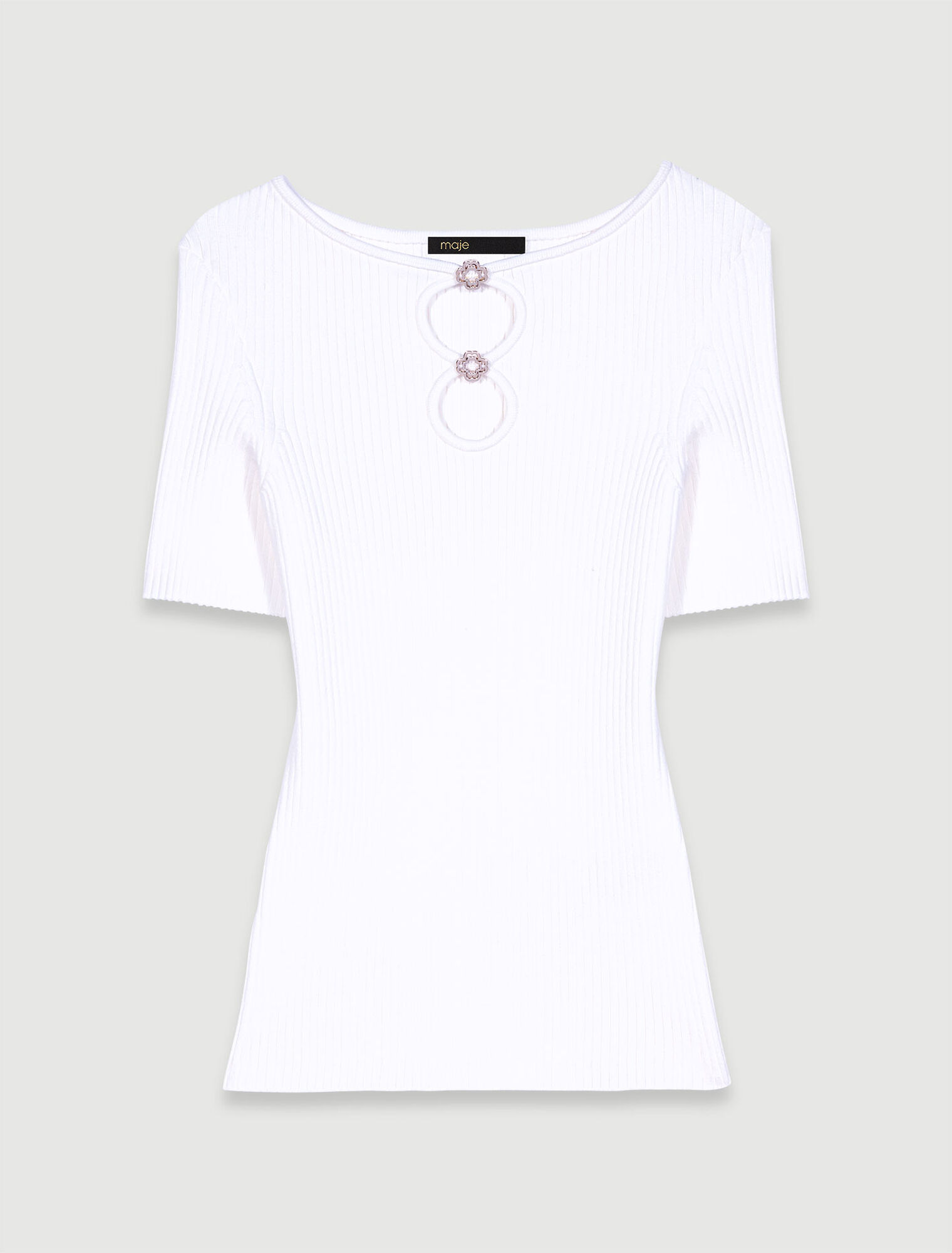 Top in maglia traforata e gioielli