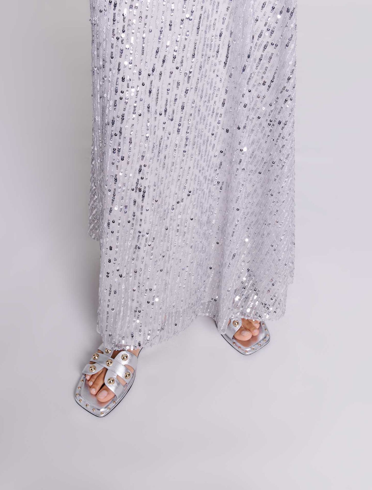 Mules in pelle borchiate