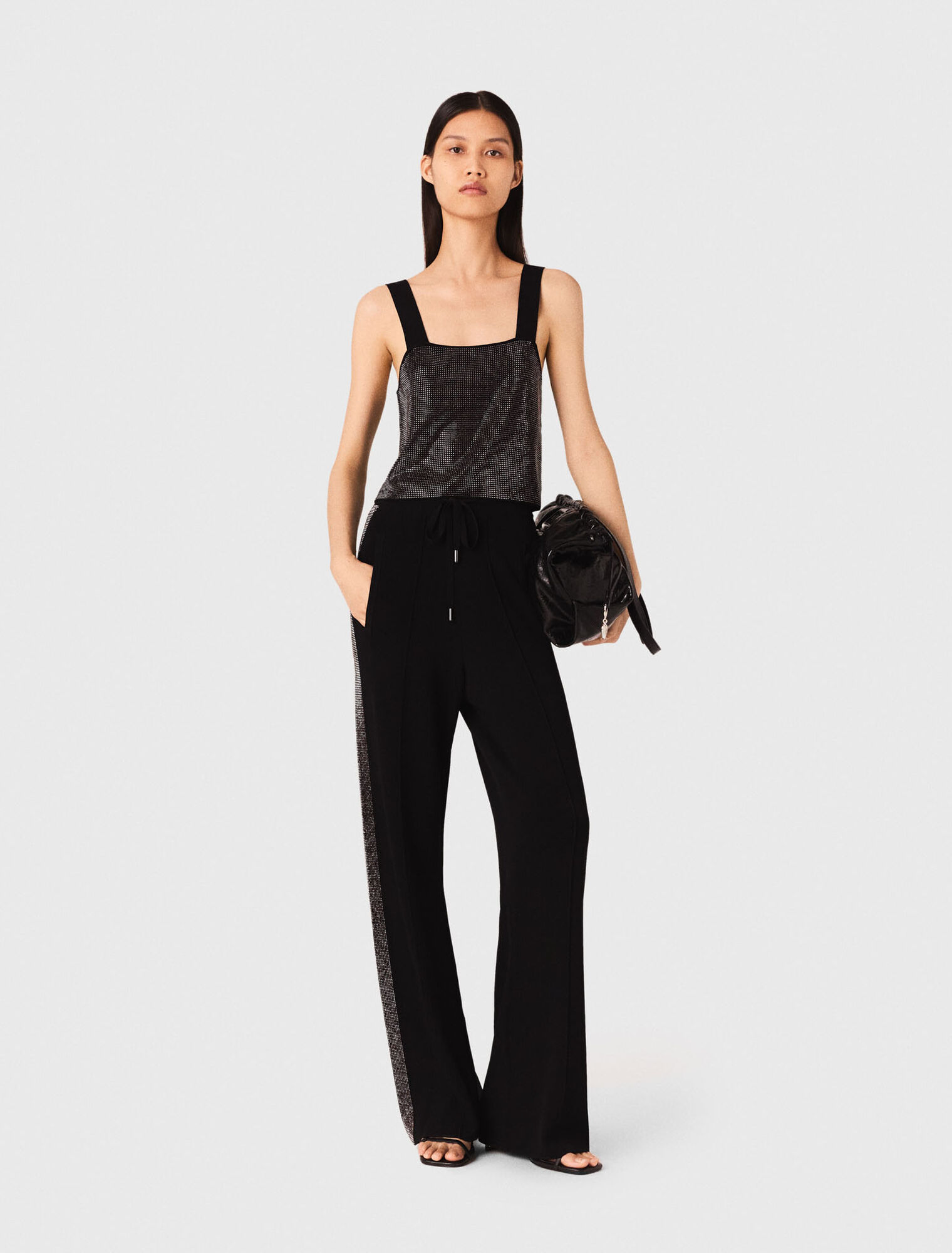 Top in maglia con bretelle e strass