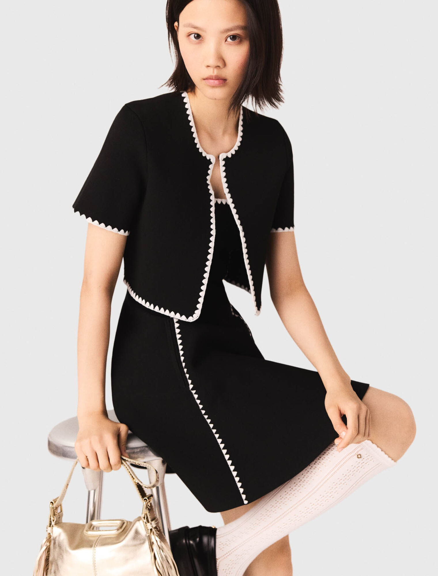 Cardigan corto con impunture