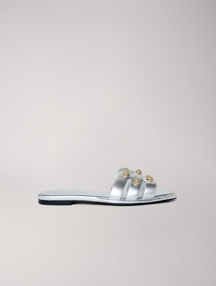 Mules in pelle borchiate