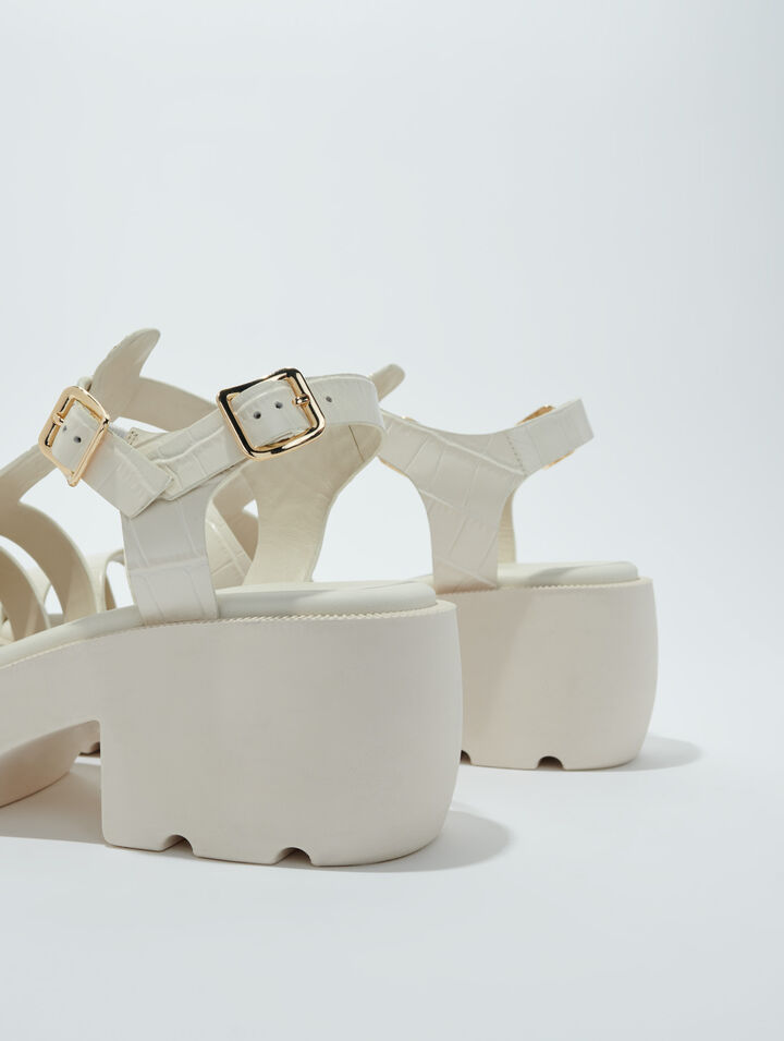 Sandali dentellati in pelle