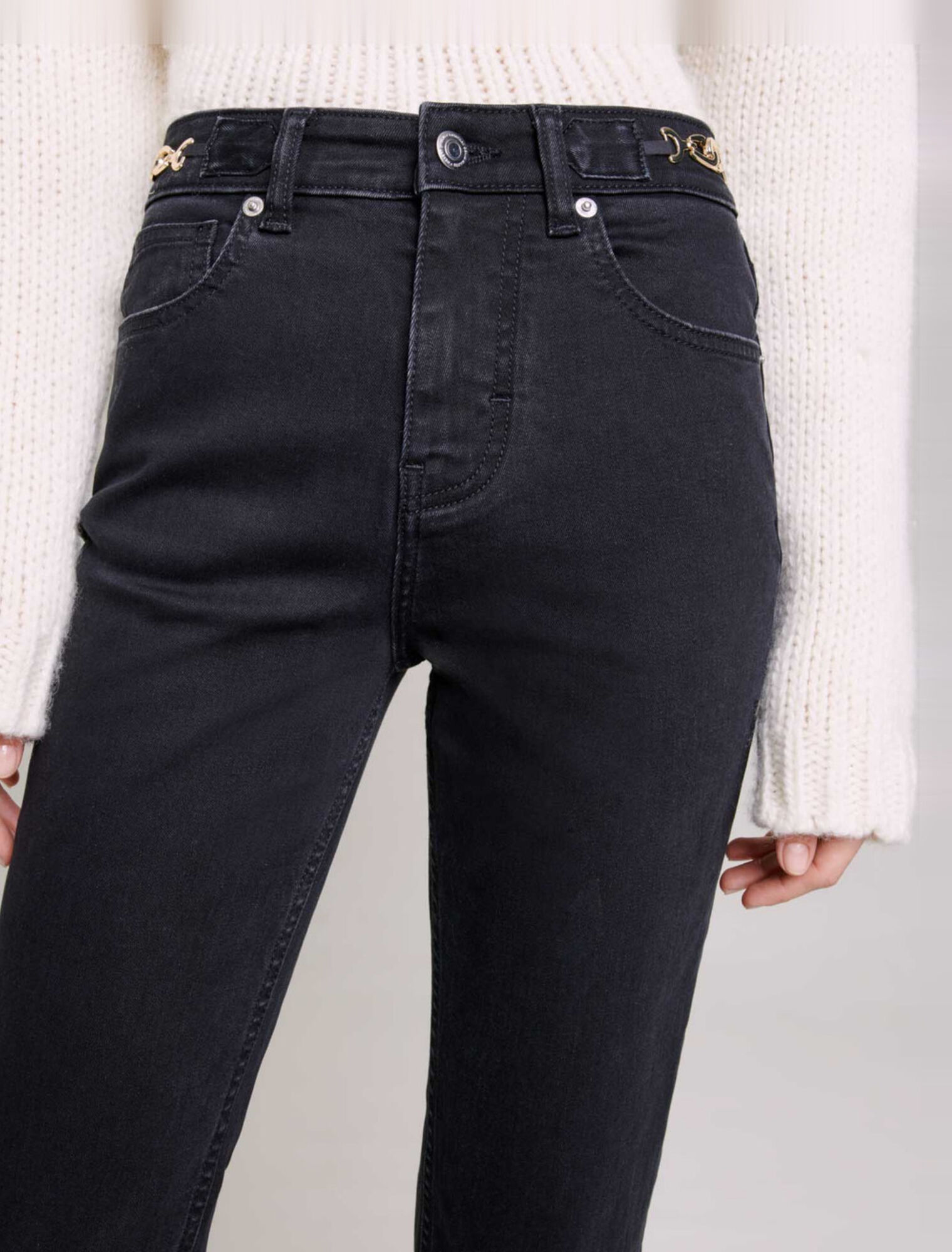 Jeans con catene e frange