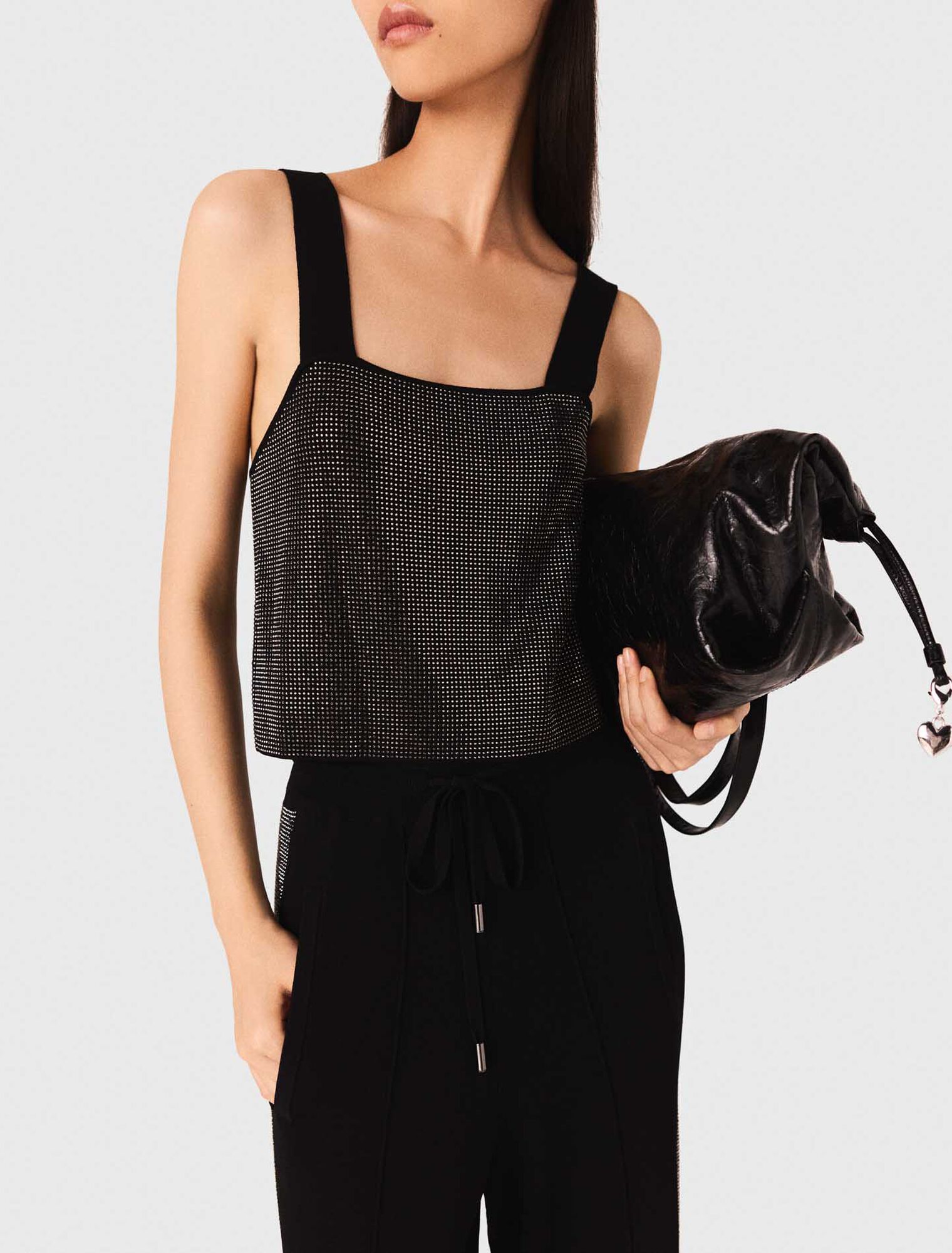 Top in maglia con bretelle e strass