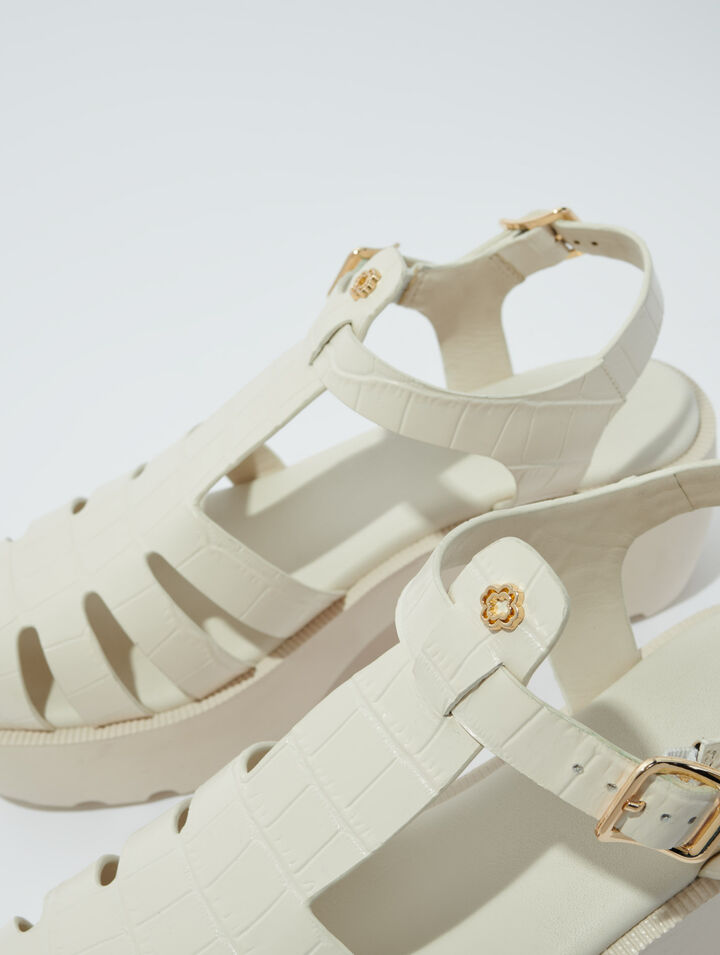 Sandali dentellati in pelle
