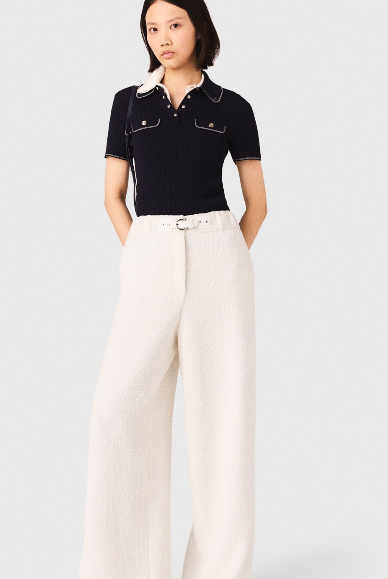 Selezione di pantaloni e jeans Maje: in primo piano i pantaloni a zampa in tweed
